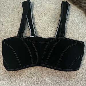 Alo black with white strips sports bra as seen on Kylie Jenner